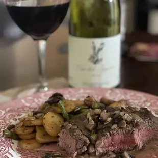 Filet mignon with mushroom sauce with a side of  potato and green beans. I used the wine to make the sauce.