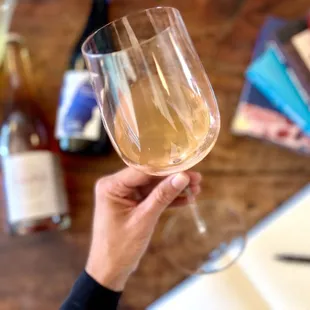 a person holding a wine glass