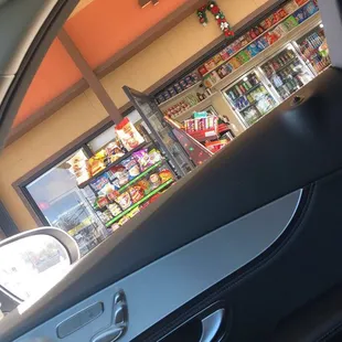 a view of a store from inside a car