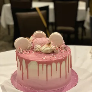 a pink cake on a table