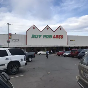 a man riding a motorcycle in a parking lot
