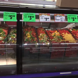 a display case with a variety of food items