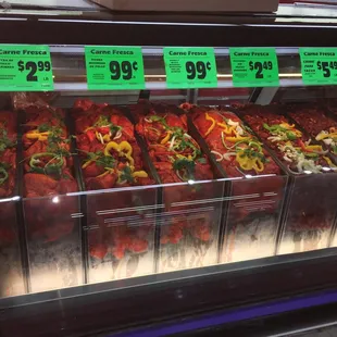 a display of meat in a grocery store