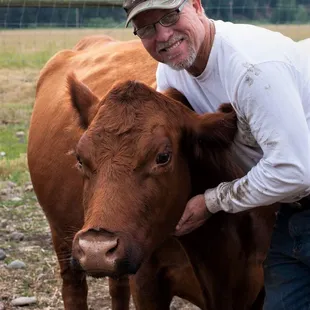 Rancher Jeff with his favorite cow. She leads everyone else wherever we ask her to go!