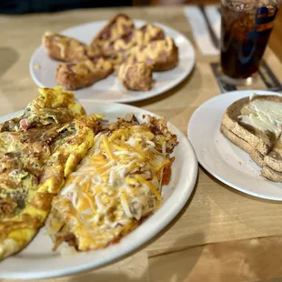 Malaka (gyro) omelet, hash browns with cheese and onions, reuben rolls, rye toast