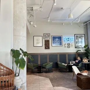 a woman sitting in a cafe