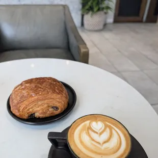 Oatmilk cappuccino and chocolate croissant