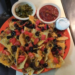 a plate of nachos and salsa