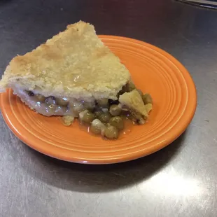 a slice of pie on an orange plate