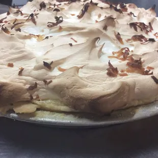 a large meringue pie on a plate