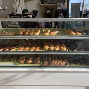 a display case filled with donuts