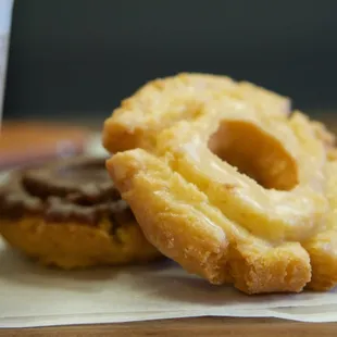 two doughnuts and a cup of coffee