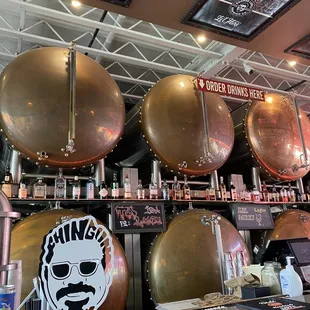 a row of copper pots