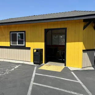 Indoor seating in a shed next to kitchen.