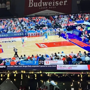 a basketball game on the big screen