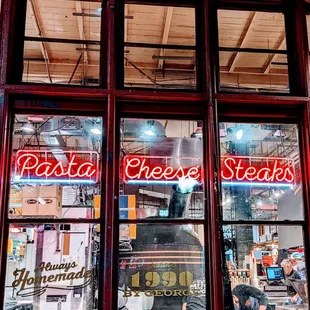 a window of a pizza shop