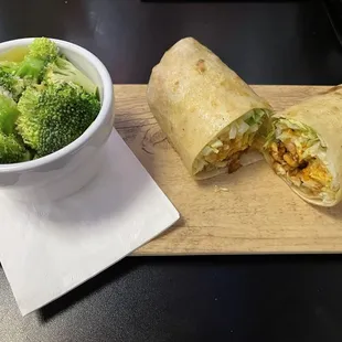 Buffalo chicken wrap with steamed broccoli.