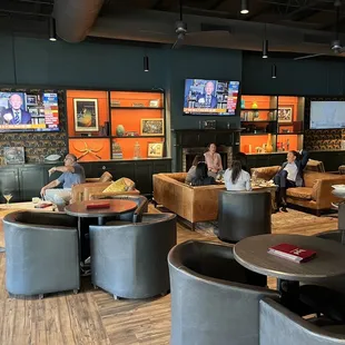 a group of people sitting in a restaurant