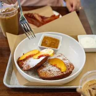a plate of french toast and a cup of coffee
