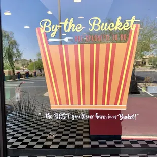 a reflection of a sign in a window