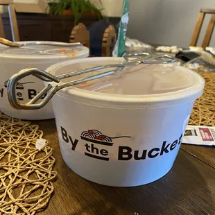 two buckets of ice cream