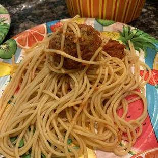 Noodles and meat ball with a wee bit of sauce.