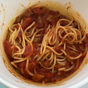 a bowl of spaghetti and meat