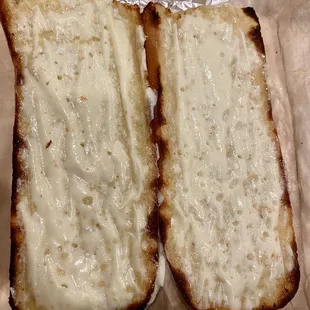 Half loaf of garlic bread + cheese