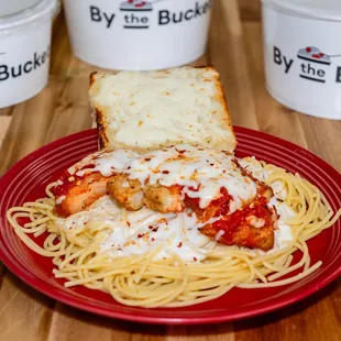 a plate of spaghetti and bread