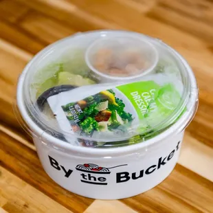 a salad in a plastic container