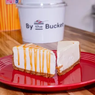 two pieces of cheesecake on a red plate