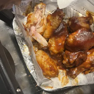 Wings that look like they was boiled in water.