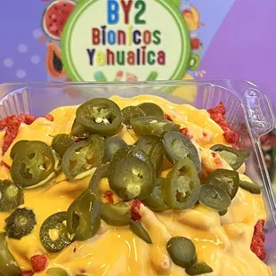 a pizza with cheese and jalapenos