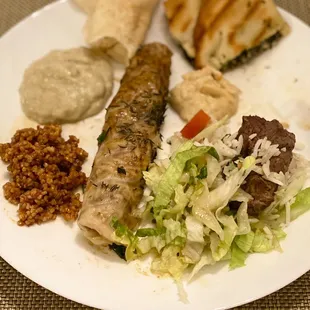 a plate of food with meat and vegetables