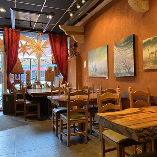 a dining room with tables and chairs