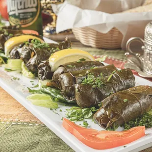 a platter of stuffed grape leaves