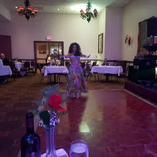 a woman dancing on the dance floor