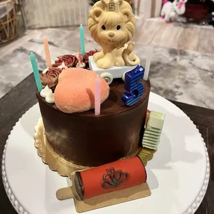 We added the lion and some more pastries to the existing chocolate cake