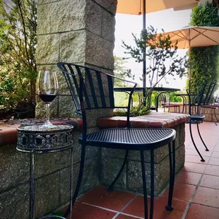 Enjoying a glass of Bates Ranch Santa Cruz Mountains Cabernet Sauvignon at Byington's immaculate estate patio tasting room.