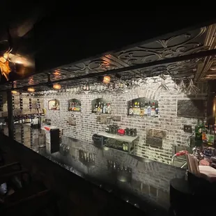 a brick wall and bar