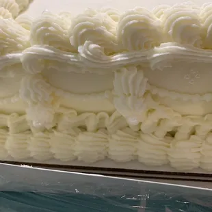 a cake with white frosting