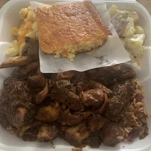 Brown Stew Chicken Macaroni and Cheese , and Potato Salad