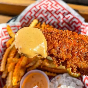 a basket of fries and sauce