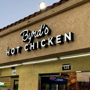 Front door and Byrd's Hot Chicken sign