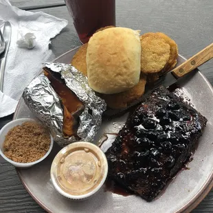 Salmon with blueberry reduction, sweet potato, and fried green tomatoes.