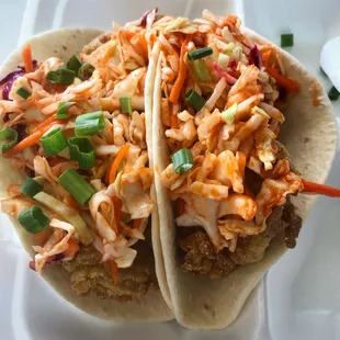 Fried Oyster Tacos with fresh Wild Caught Rappahannock Oysters lightly fried topped with Sriracha lime slaw.
