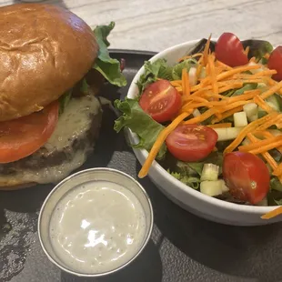 Burger with salad &amp; bleu cheese.