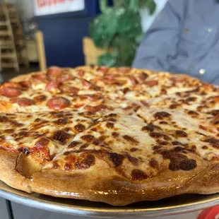 Pizza half cheese and half cheese &amp; pepperonis.