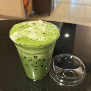 Iced matcha latte with vanilla sweet cream cold foam and oat milk