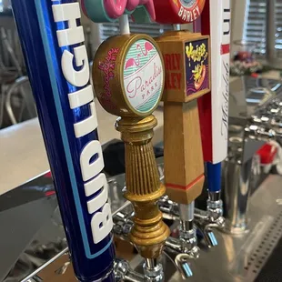 a row of beer taps